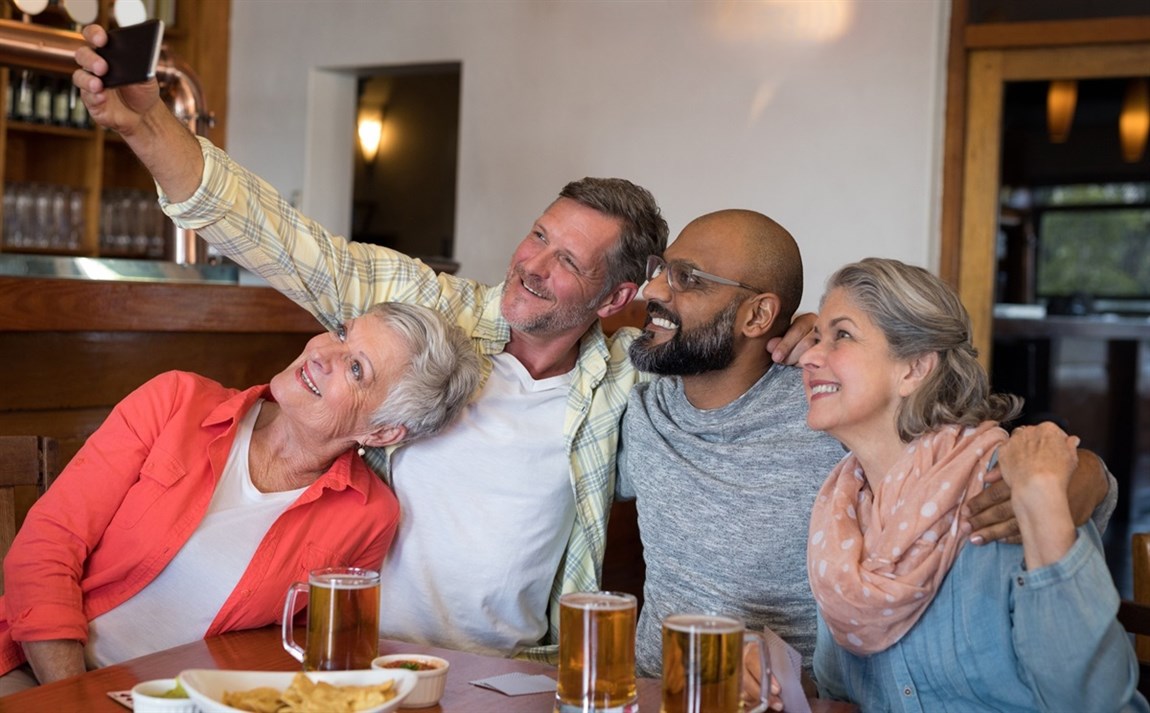 Traveling friends gathered taking a selfie Photo