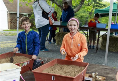 Two children enjoy archaeology activities Photo