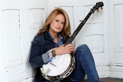 Woman holding banjo Photo