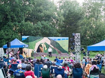 An outdoor crowd watching a performance Photo