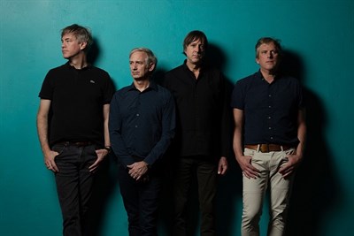 Band members standing in a line Photo