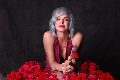 Storm Large in a red dress Photo