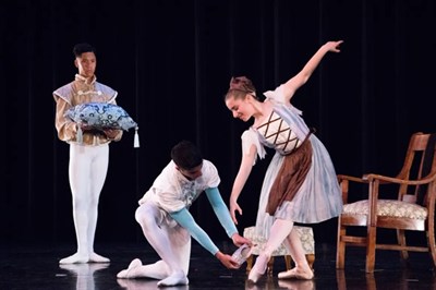 The Prince tries the glass slipper on Cinderella Photo