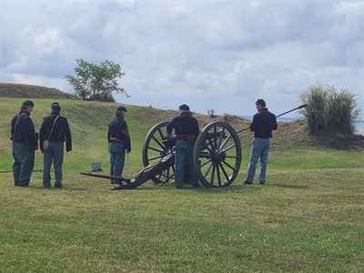 Artillery crew getting ready to fire a Civil War era cannon Photo