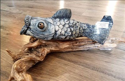 A wood carving of a fish at the Arts By the Bay Gallery Photo
