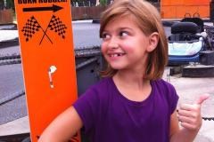 Girl giving thumbs up to racing at The Go-Kart Track-White Marsh Photo