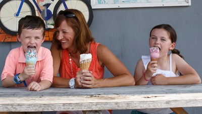 A Mother, son and daughter enjoying an ice cream cone from Scottish Highland Creamery Photo