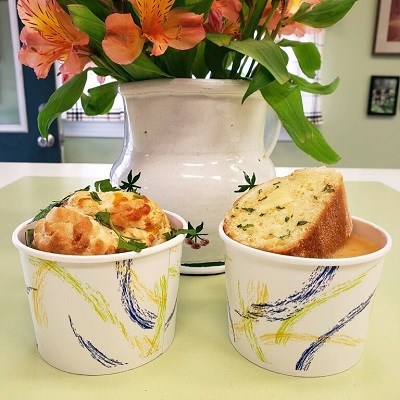food on a table with a flower arrangement Photo