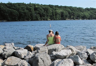 Mom and daughter by lake Photo