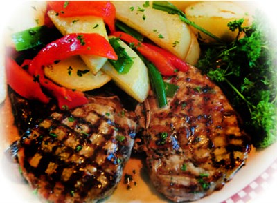 Grilled Pork Chops, mixed vegetables and broccoli Photo