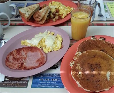 Pancakes, eggs, ham and juice Photo