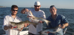 Photo of three man with big fish Photo
