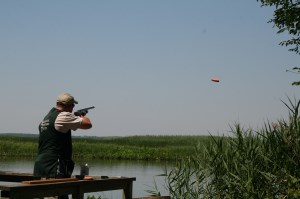 Man shooting a clay pigeon Photo
