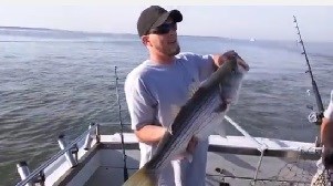 Man holding up a quality fish Photo