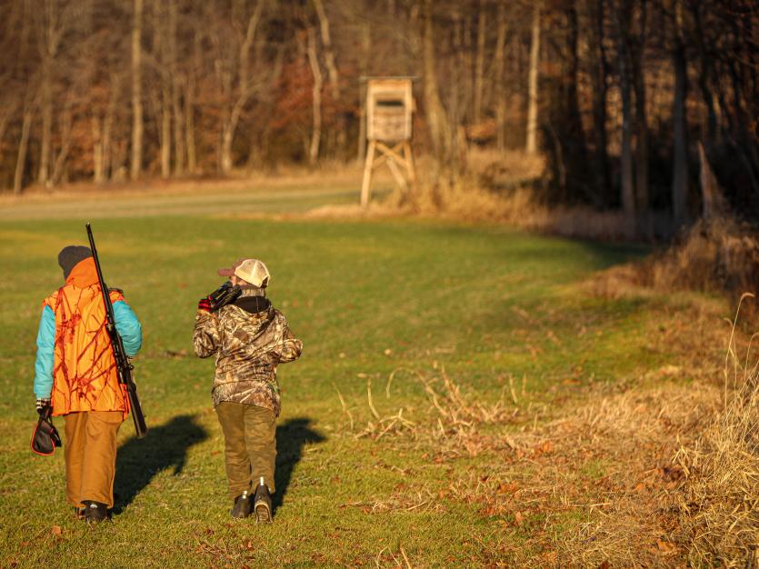 Two children practicing hunting