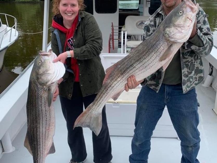 Father and daughter on fishing boat