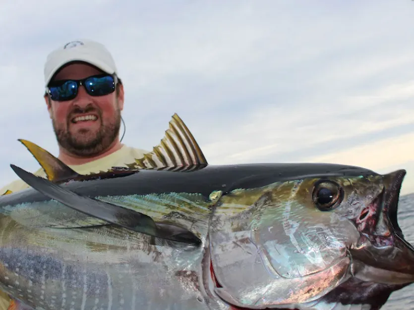 Fisherman holding a large tuna