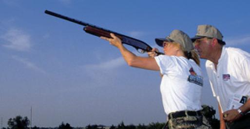 Instructor and student skeet shooting