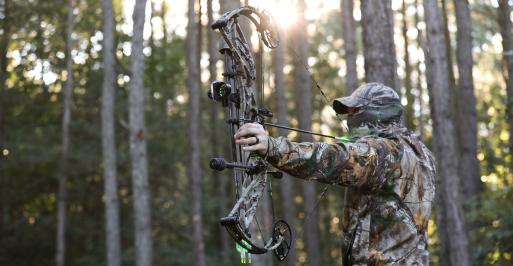 Archer hunting in full camouflage