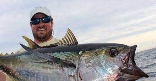 Fisherman holding a large tuna