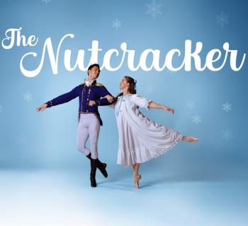 Two dancers posing with snowflakes in the background Photo