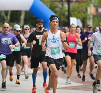 Runners taking part in the Family Fun Run at the Camden Yard Sports Complex Photo