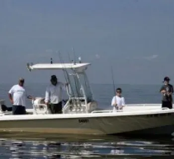 Captain Gary and a few fly fishing patrons Photo