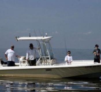 Captain Gary and a few fly fishing patrons Photo