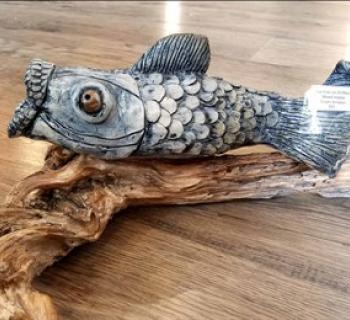 A wood carving of a fish at the Arts By the Bay Gallery Photo