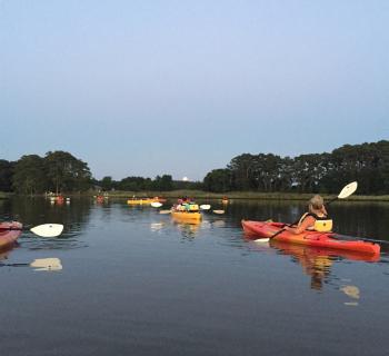 Kayak at moon rise Photo