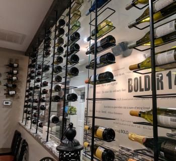 Wine bottles on the wall Photo
