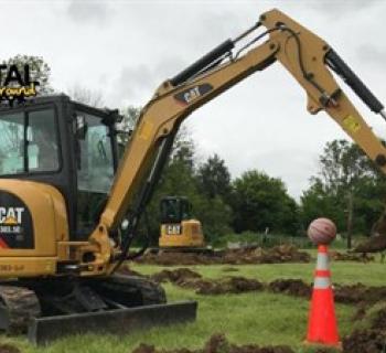 Track excavator with basketball Photo
