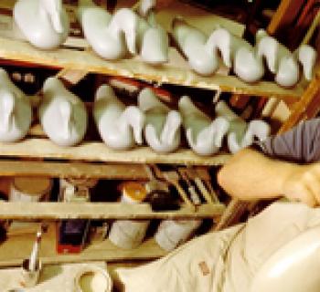 Man carving decoy ducks Photo