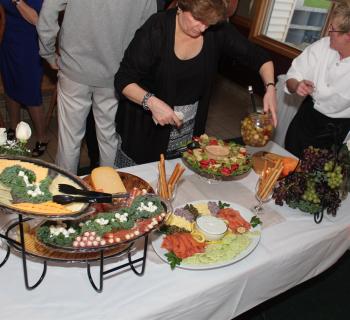 People eating a buffet style meal Photo