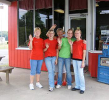 Group waves outside Cindy's East Side Kitchen. Photo