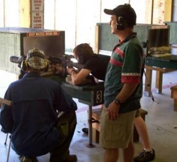 Shooters at the shooting range. Photo