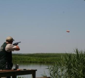 Man shooting a clay pigeon Photo