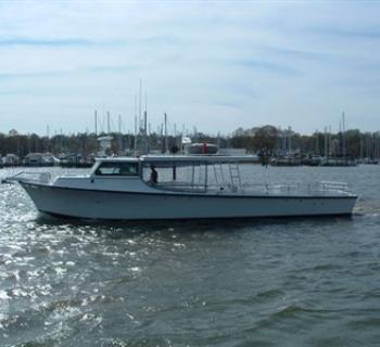 The Charter Boat "Wound Tight" works the mid-bay Photo