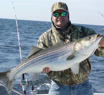 Fisherman with Rock Fish. Photo