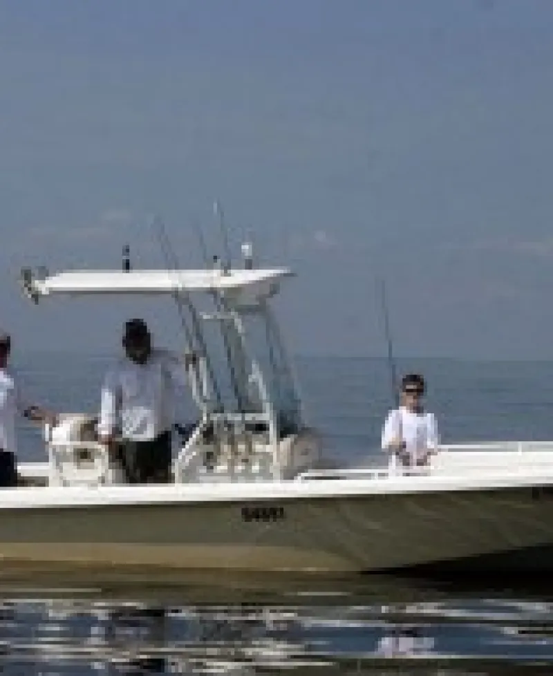 Captain Gary and a few fly fishing patrons Photo