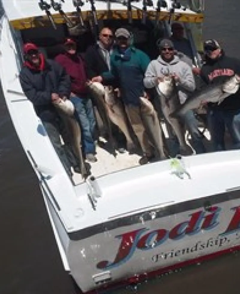 Picture of fishing party holding up their catch of Rockfish aboard the Jodi Lee Photo