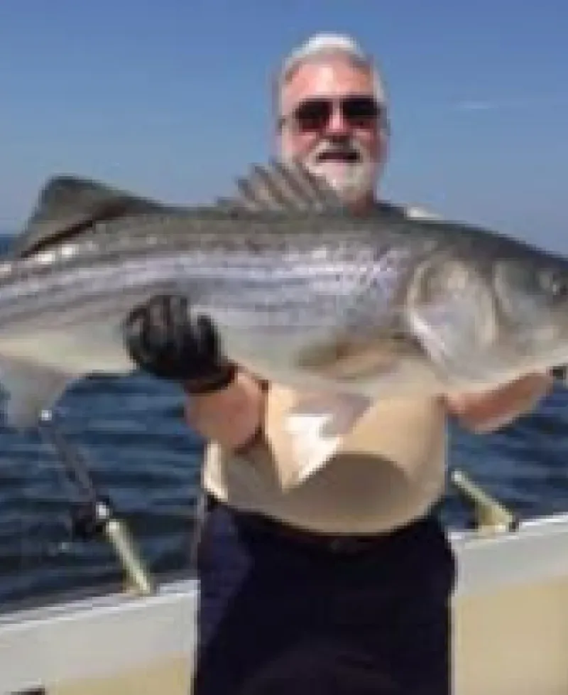 Man holding large fish Photo