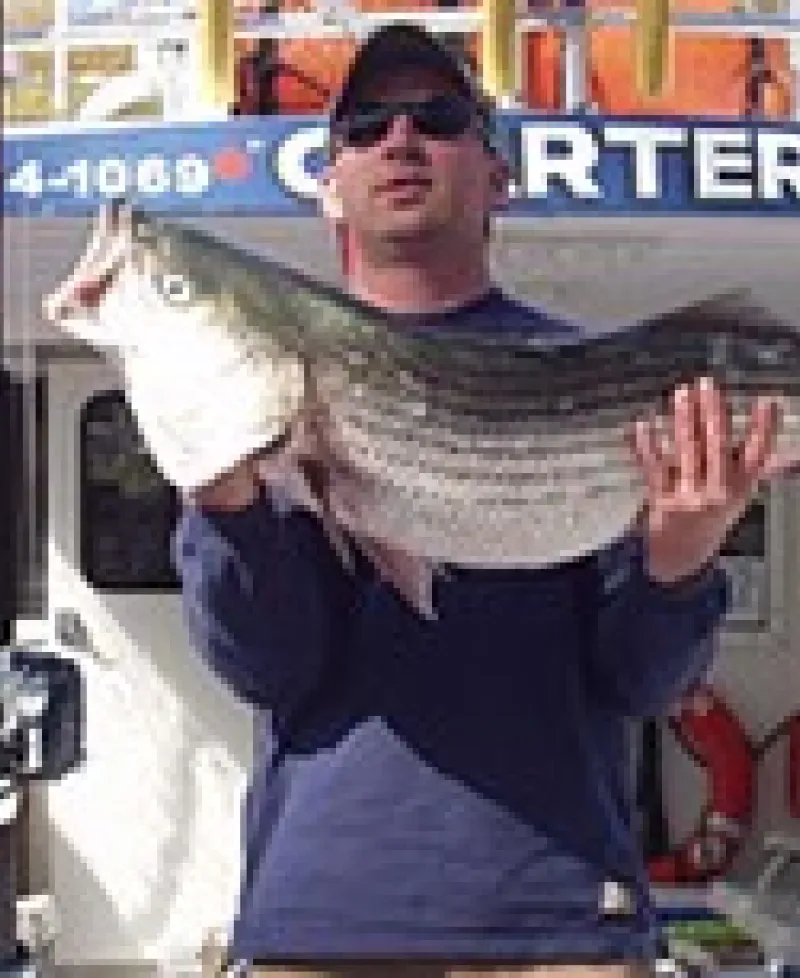 Kenneth Jeffries holding large fish aboard Charter Boat Photo