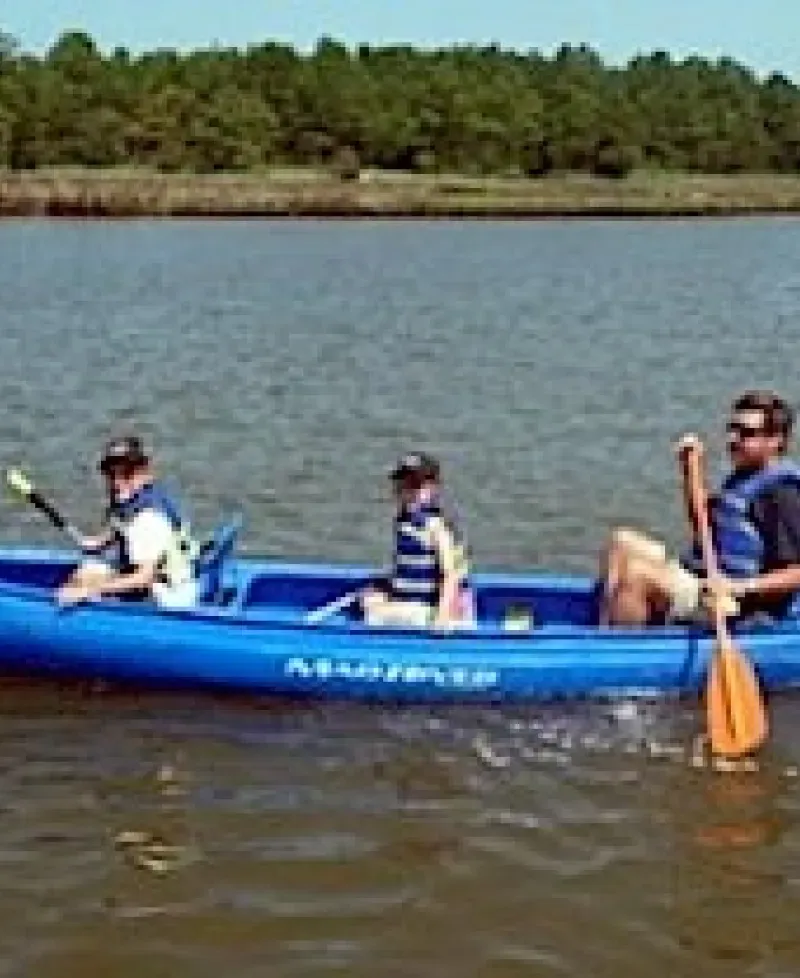 Father and children kayaking Photo