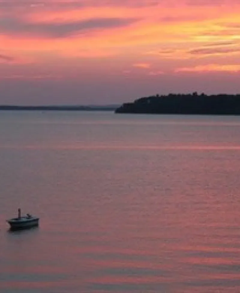 Crystal Beach at Sunset with small boat Photo