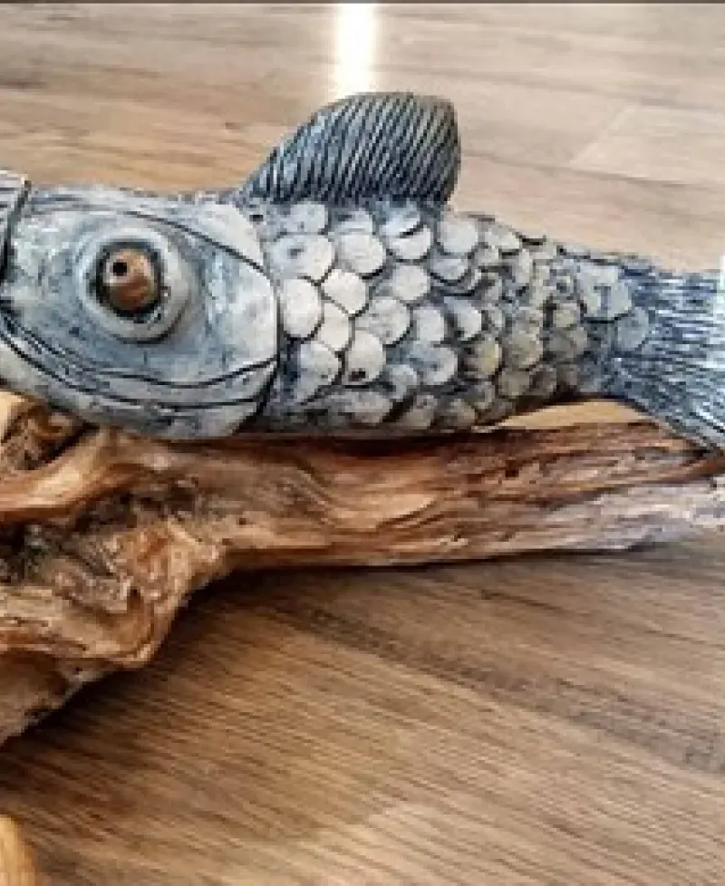 A wood carving of a fish at the Arts By the Bay Gallery Photo