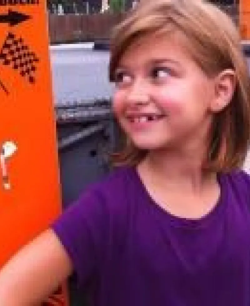 Girl giving thumbs up to racing at The Go-Kart Track-White Marsh Photo