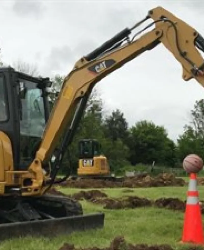 Track excavator with basketball Photo