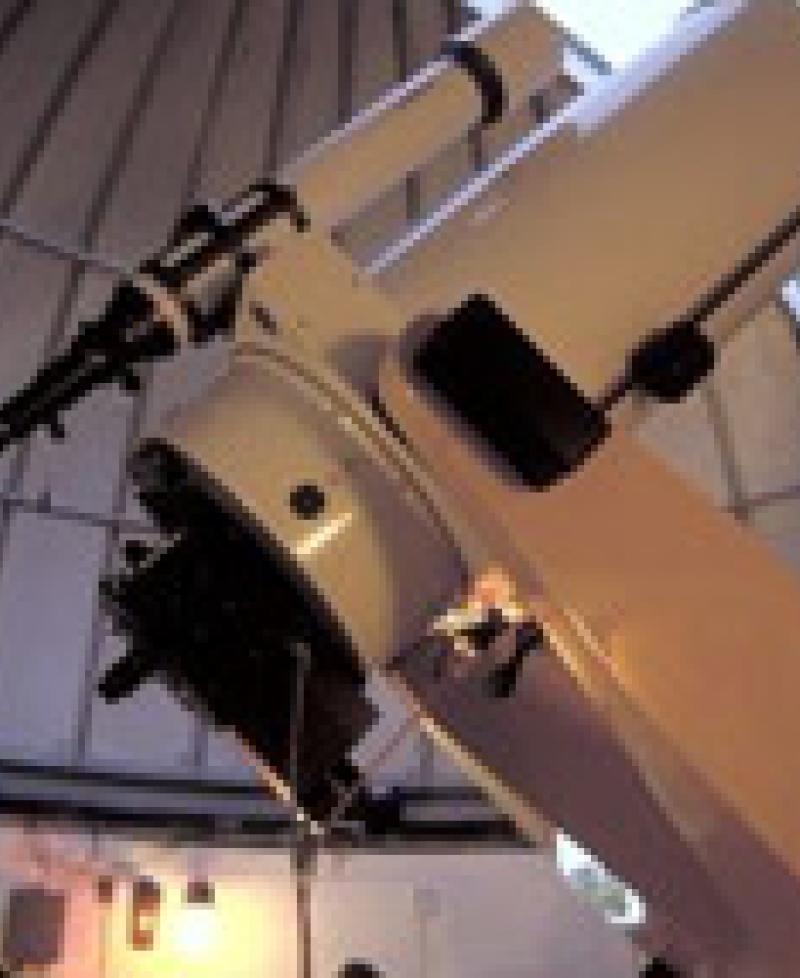 Scientist and Telescope Photo