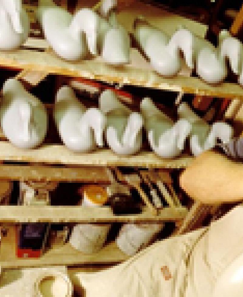 Man carving decoy ducks Photo